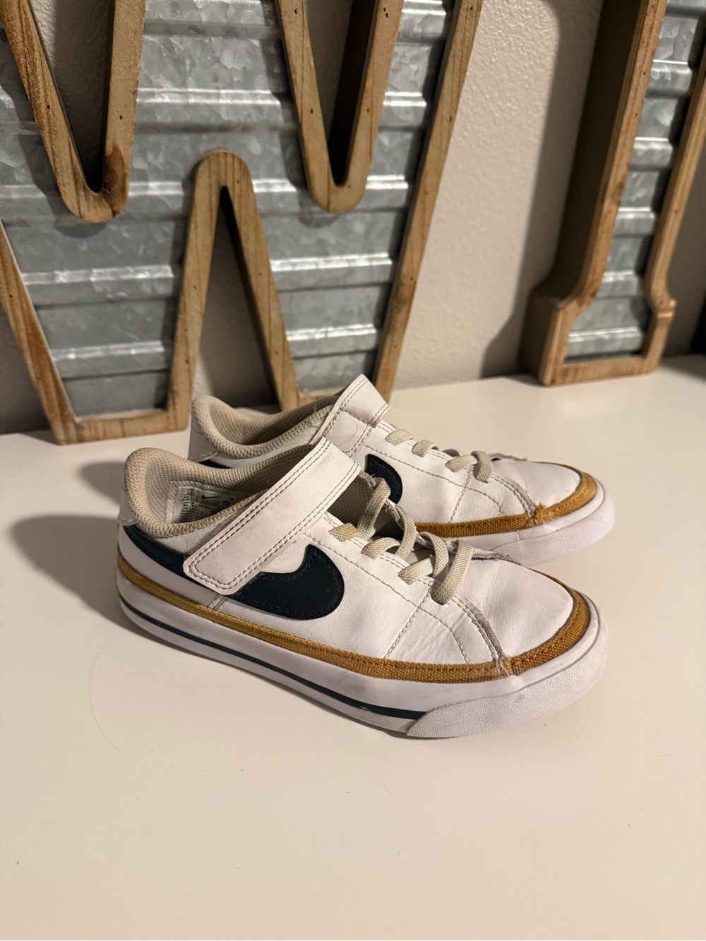 Nike Court Legacy White Sneakers with Black Swoosh and Brown Trim